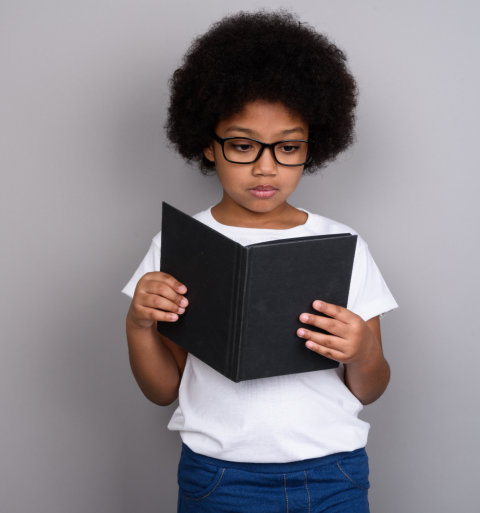 little girl reading something